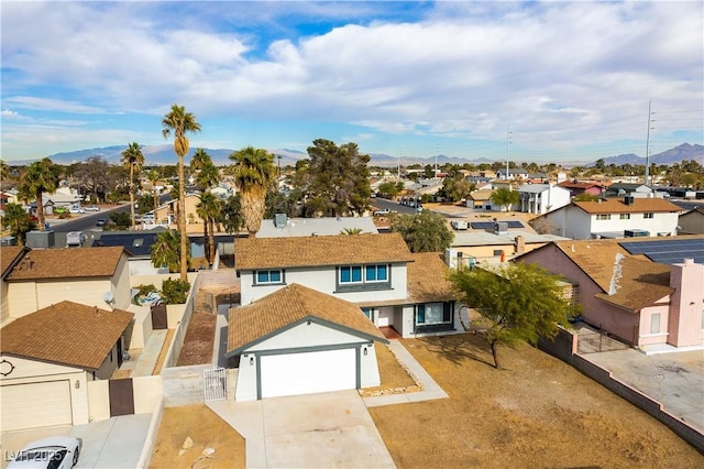 birds eye view of property with a residential view and a mountain view