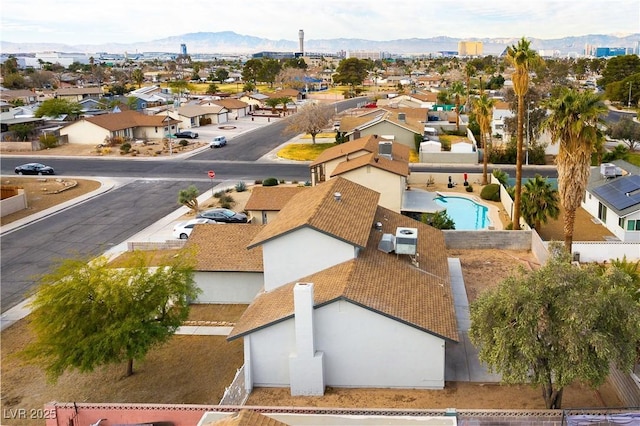 birds eye view of property with a mountain view and a residential view