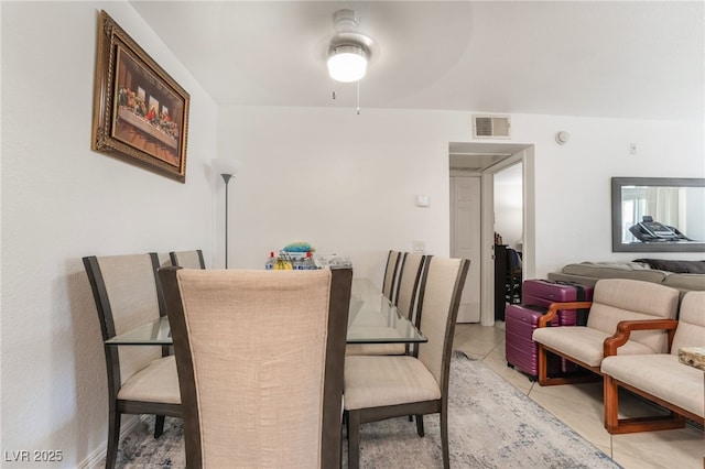 dining area with ceiling fan, visible vents, and light tile patterned floors