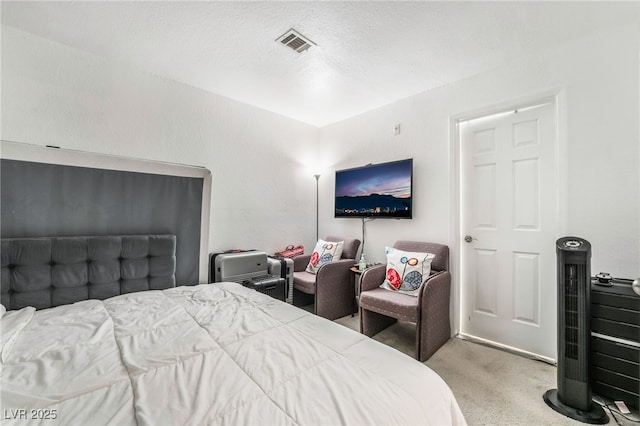 bedroom featuring visible vents and carpet