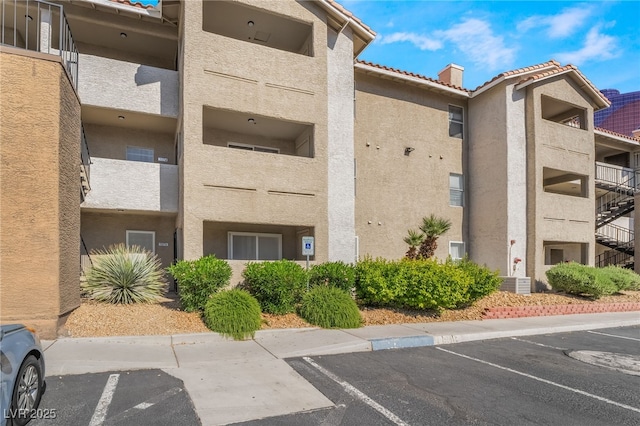 view of property with uncovered parking