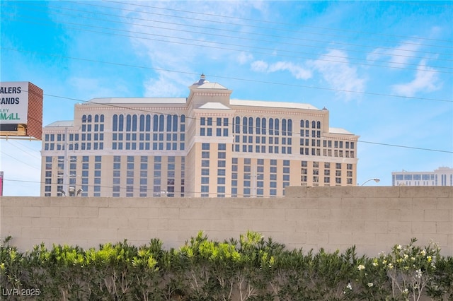 view of building exterior with fence