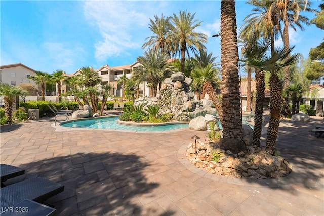 pool featuring a residential view and a patio