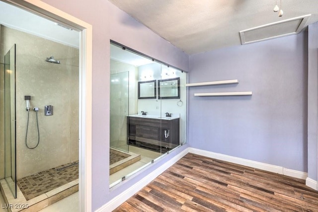 417 Wisteria Ave, Las Vegas, NV 89107 - full bath with wood finished floors, a shower stall, and vanity
