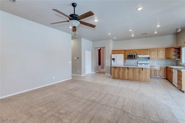 3684 Mooncrest Cir, Las Vegas, NV 89129 - kitchen with white appliances, open shelves, a kitchen island, under cabinet range hood, and light tile patterned flooring