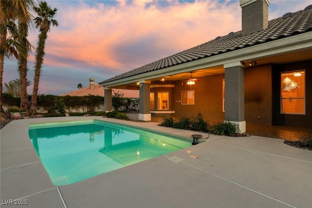 3684 Mooncrest Cir, Las Vegas, NV 89129 - pool at dusk featuring a patio area and an outdoor pool