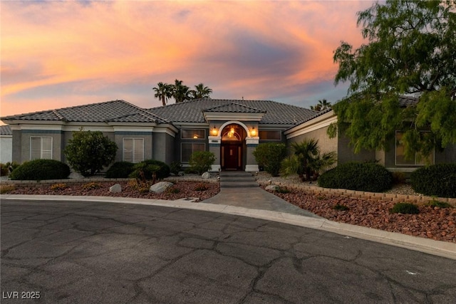 3684 Mooncrest Cir, Las Vegas, NV 89129 - mediterranean / spanish house featuring stucco siding and a tiled roof