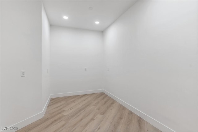 spare room with recessed lighting, baseboards, and light wood-style floors