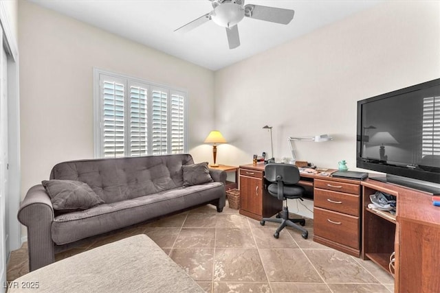 office featuring light tile patterned floors and ceiling fan