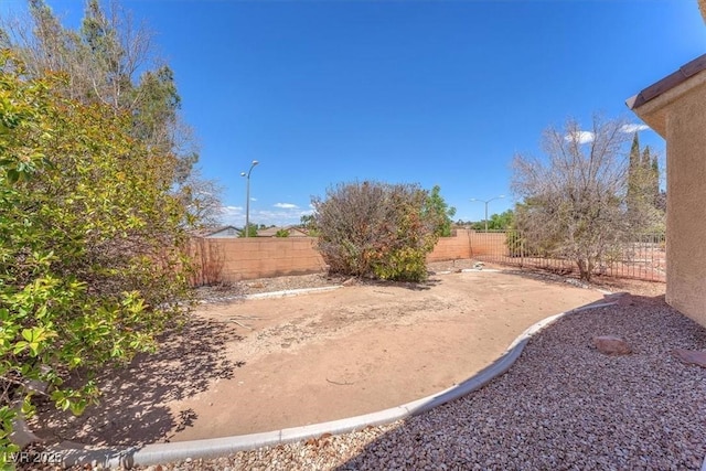 view of yard with a patio and a fenced backyard