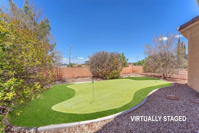 view of yard with a fenced backyard