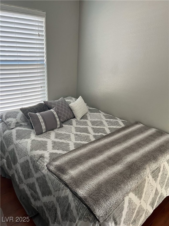 bedroom with wood finished floors