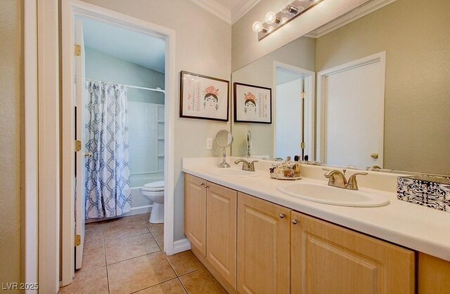 8811 Tomnitz Ave Unit 101, Las Vegas, NV 89178 - bathroom featuring ornamental molding, tile patterned floors, double vanity, toilet, and shower / tub combo with curtain