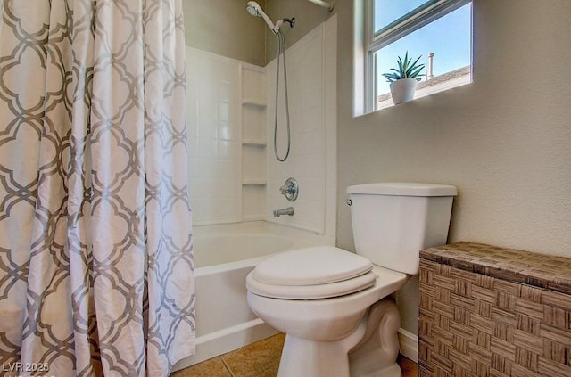 full bath featuring toilet, shower / bath combo, and tile patterned floors