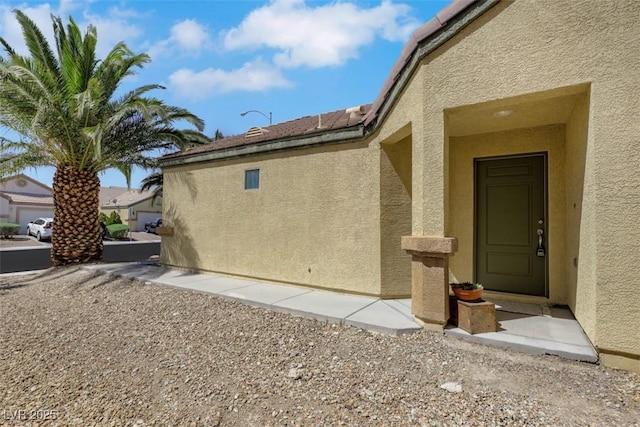 view of side of home featuring stucco siding