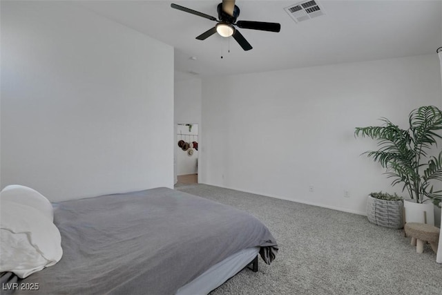 carpeted bedroom featuring visible vents and a ceiling fan