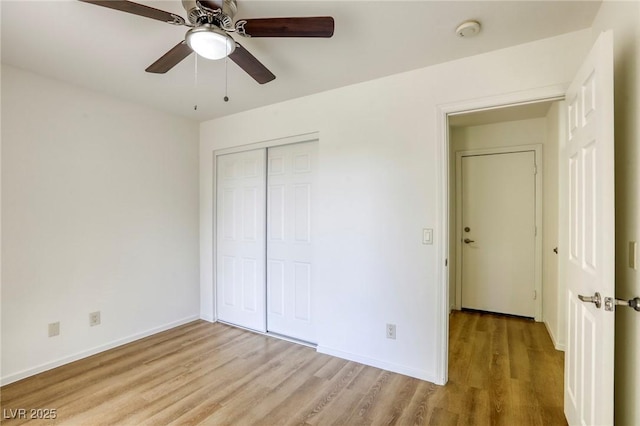 9966 Mystic Moss St, Las Vegas, NV 89183 - unfurnished bedroom featuring a closet, a ceiling fan, light wood-style flooring, and baseboards