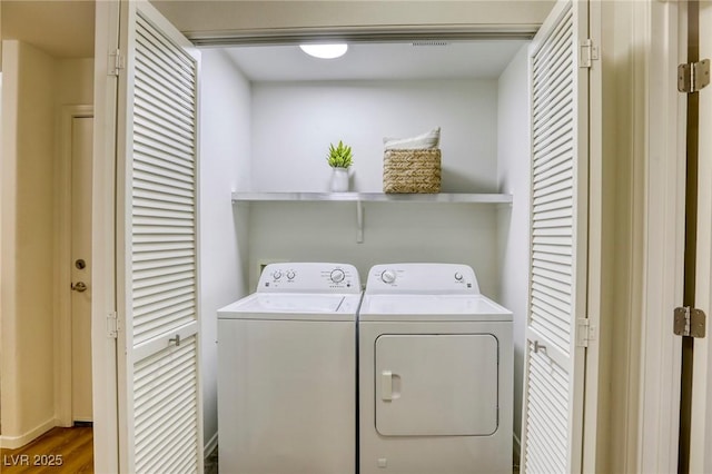 9966 Mystic Moss St, Las Vegas, NV 89183 - washroom with washing machine and clothes dryer, wood finished floors, and laundry area