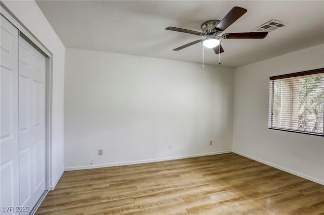 9966 Mystic Moss St, Las Vegas, NV 89183 - unfurnished bedroom featuring a ceiling fan, visible vents, baseboards, and light wood-type flooring