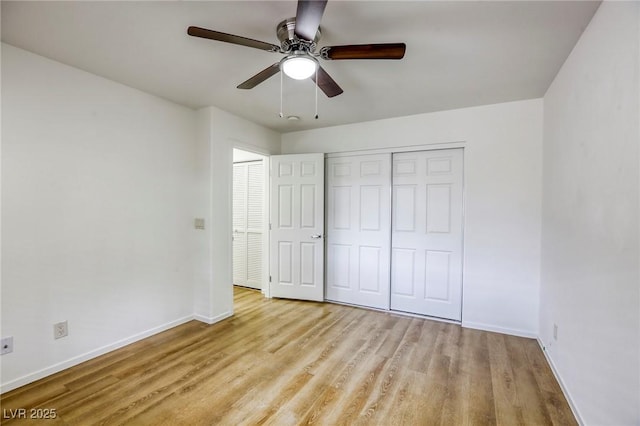 9966 Mystic Moss St, Las Vegas, NV 89183 - unfurnished bedroom featuring wood finished floors, ceiling fan, a closet, and baseboards