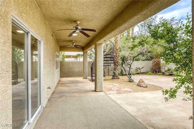 9966 Mystic Moss St, Las Vegas, NV 89183 - view of patio with a ceiling fan and a fenced backyard