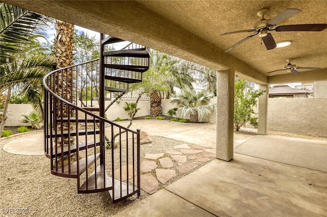 9966 Mystic Moss St, Las Vegas, NV 89183 - view of patio / terrace featuring stairway, a ceiling fan, and a fenced backyard