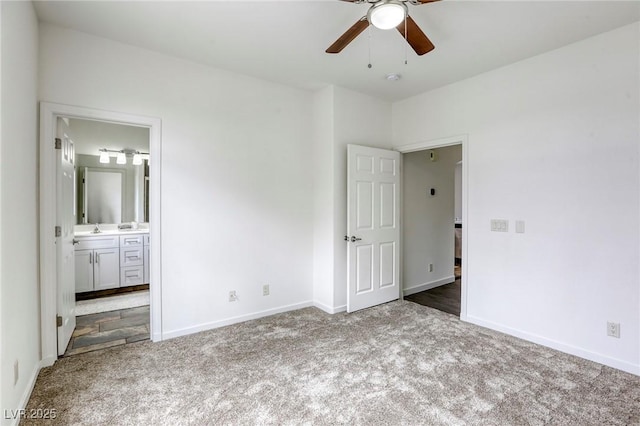 9966 Mystic Moss St, Las Vegas, NV 89183 - unfurnished bedroom featuring a sink, baseboards, carpet floors, a ceiling fan, and ensuite bath