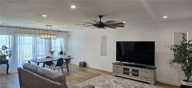 314 W Winston Ln, Indian Springs, NV 89018 - living area featuring ceiling fan, light wood finished floors, and baseboards