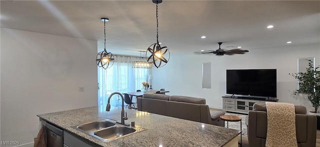314 W Winston Ln, Indian Springs, NV 89018 - kitchen featuring a sink, ceiling fan, open floor plan, dishwashing machine, and a center island with sink