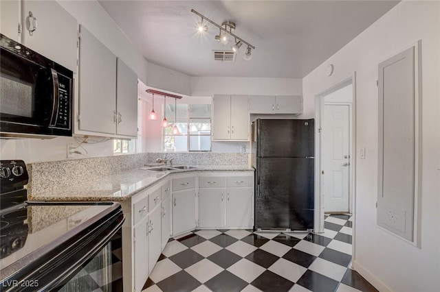 709 New Mexico St, Boulder City, NV 89005 - kitchen with dark floors, black appliances, a sink, white cabinetry, and visible vents