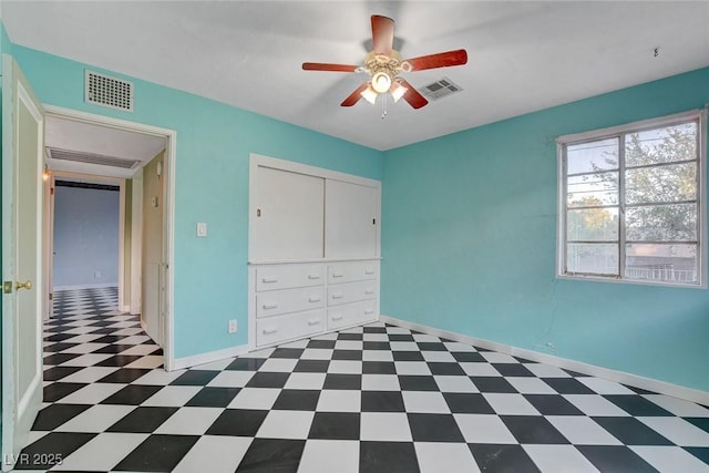 709 New Mexico St, Boulder City, NV 89005 - unfurnished bedroom with tile patterned floors, visible vents, and baseboards