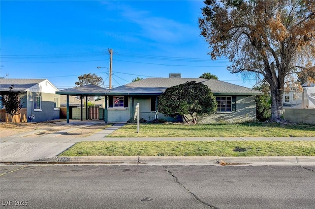 709 New Mexico St, Boulder City, NV 89005 - ranch-style home with a front yard, driveway, an attached carport, and fence