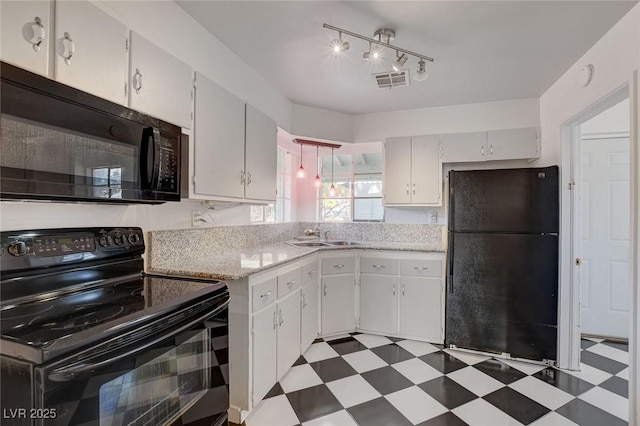 709 New Mexico St, Boulder City, NV 89005 - kitchen with a sink, black appliances, visible vents, dark floors, and white cabinets