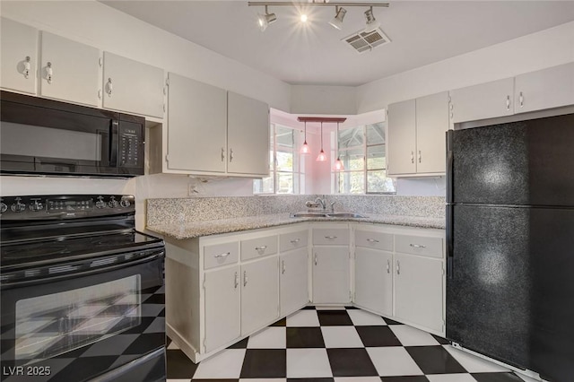 709 New Mexico St, Boulder City, NV 89005 - kitchen featuring black appliances, a sink, tile patterned floors, and visible vents