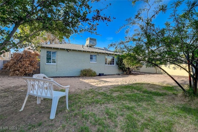 709 New Mexico St, Boulder City, NV 89005 - back of house with fence, central air condition unit, and brick siding