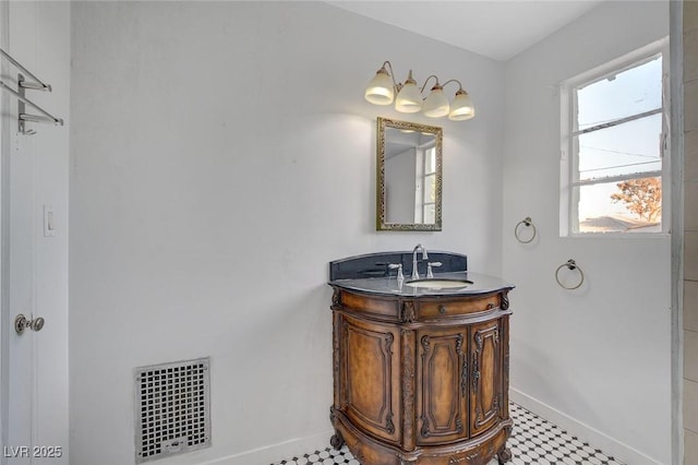 709 New Mexico St, Boulder City, NV 89005 - bathroom featuring tile patterned floors, visible vents, vanity, and baseboards