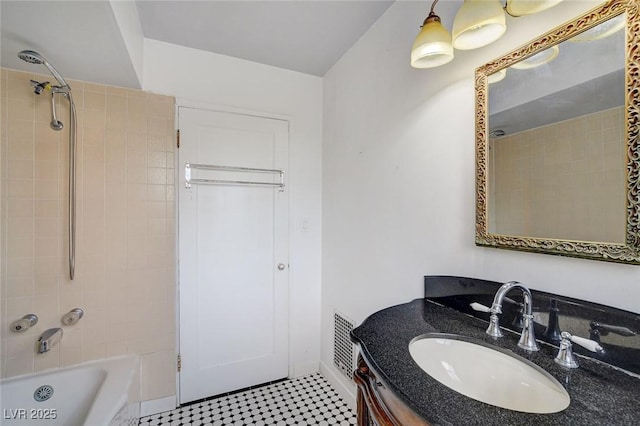 709 New Mexico St, Boulder City, NV 89005 - bathroom with visible vents, washtub / shower combination, vanity, and baseboards