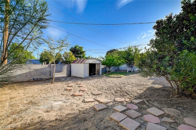 709 New Mexico St, Boulder City, NV 89005 - view of yard with an outdoor structure, a storage shed, and a fenced backyard