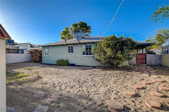 709 New Mexico St, Boulder City, NV 89005 - rear view of property featuring fence, a gate, and central AC unit