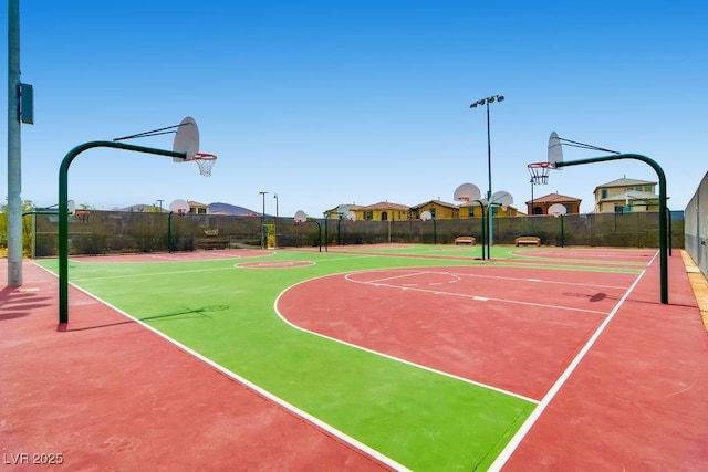 view of sport court with community basketball court and fence