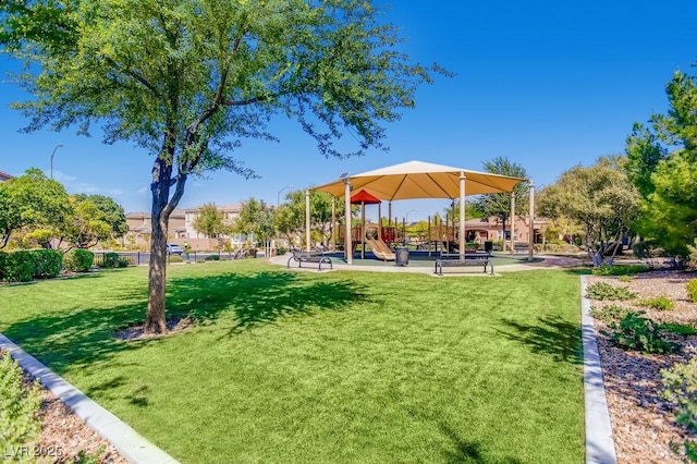 view of property's community with a lawn