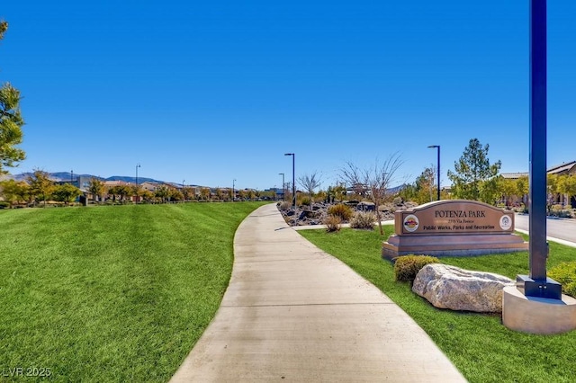 view of community featuring a yard and a mountain view