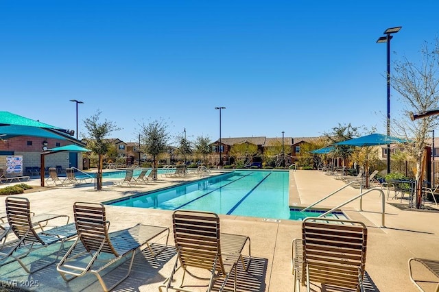 community pool featuring a patio area