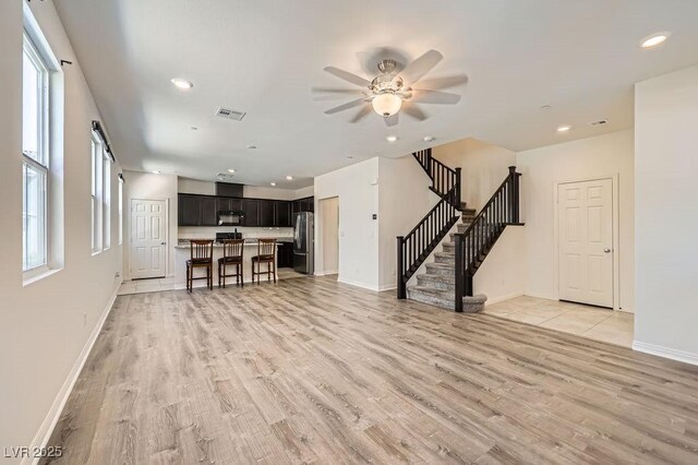 2862 Starling Summit St, Henderson, NV 89044 - living area with light wood finished floors, stairs, ceiling fan, baseboards, and recessed lighting