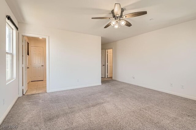 2862 Starling Summit St, Henderson, NV 89044 - empty room featuring light colored carpet, a ceiling fan, and baseboards