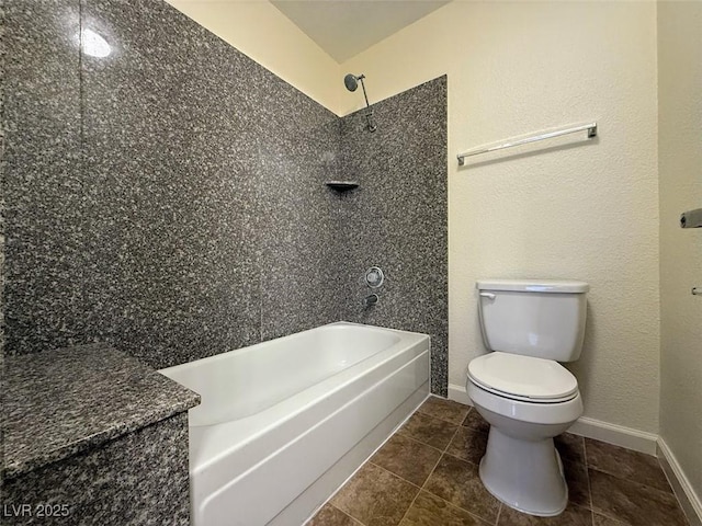 bathroom with toilet, tile patterned flooring, and shower / bath combination