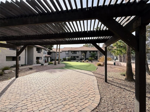 surrounding community with fence and a residential view