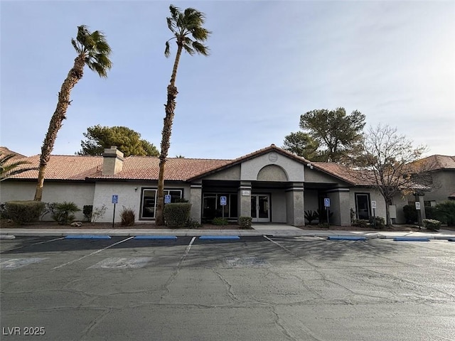 view of property featuring uncovered parking