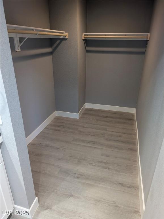 2716 Knightsbridge Rd, Henderson, NV 89074 - spacious closet featuring wood finished floors