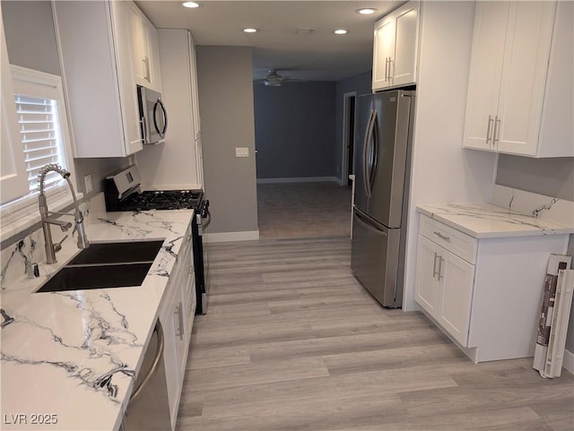 2716 Knightsbridge Rd, Henderson, NV 89074 - kitchen featuring white cabinets, a sink, appliances with stainless steel finishes, ceiling fan, and recessed lighting